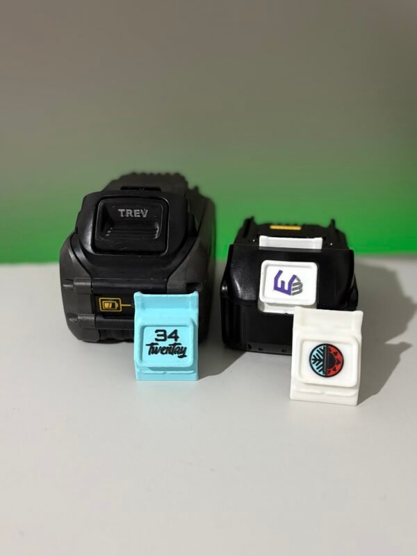 Custom battery button with embossed company logo for construction fleet tool asset protection
