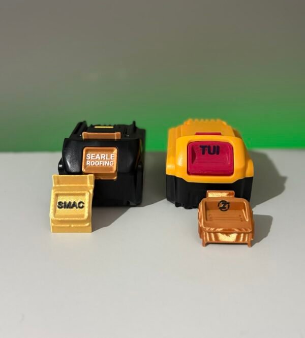 Pack of custom battery buttons with embossed names fitted to Makita, and DeWalt tool batteries