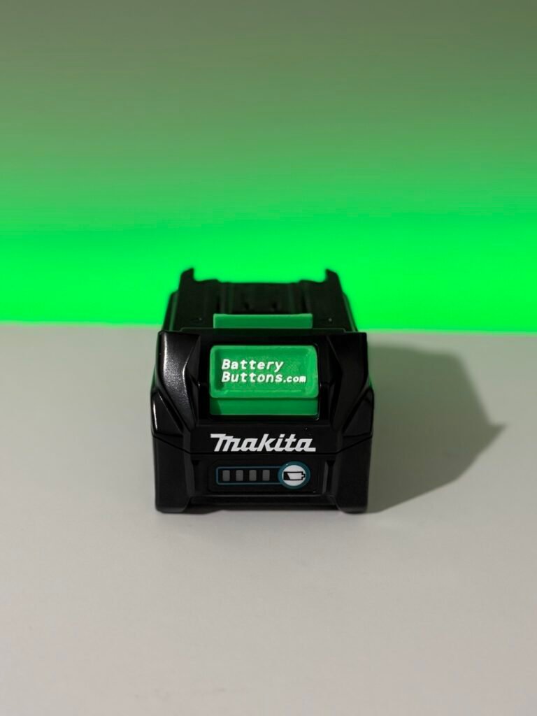 Step photo showing a custom Z Battery Button positioned in a Makita 40V XGT battery top cover before refitting the cover. The same button placement process applies to compatible Makita 18V LXT batteries.