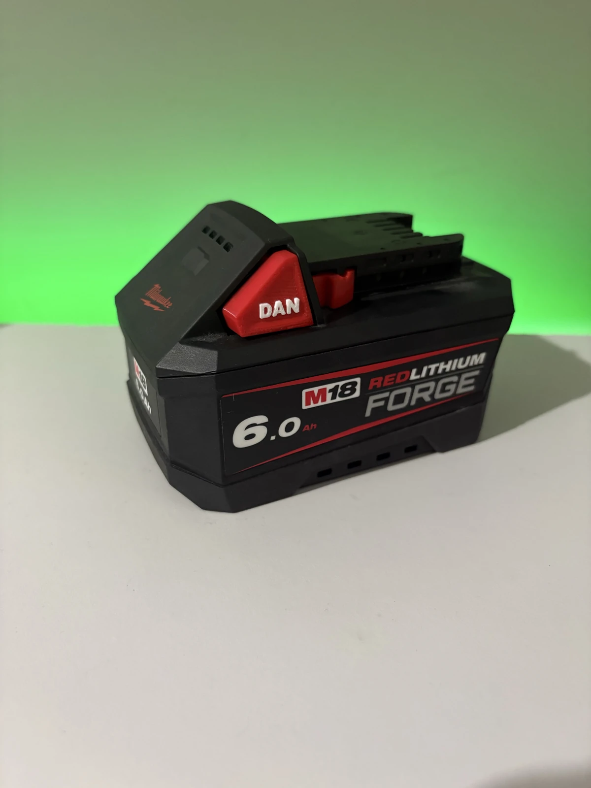 Milwaukee M18 battery fully assembled with red DAN custom Z Battery Buttons